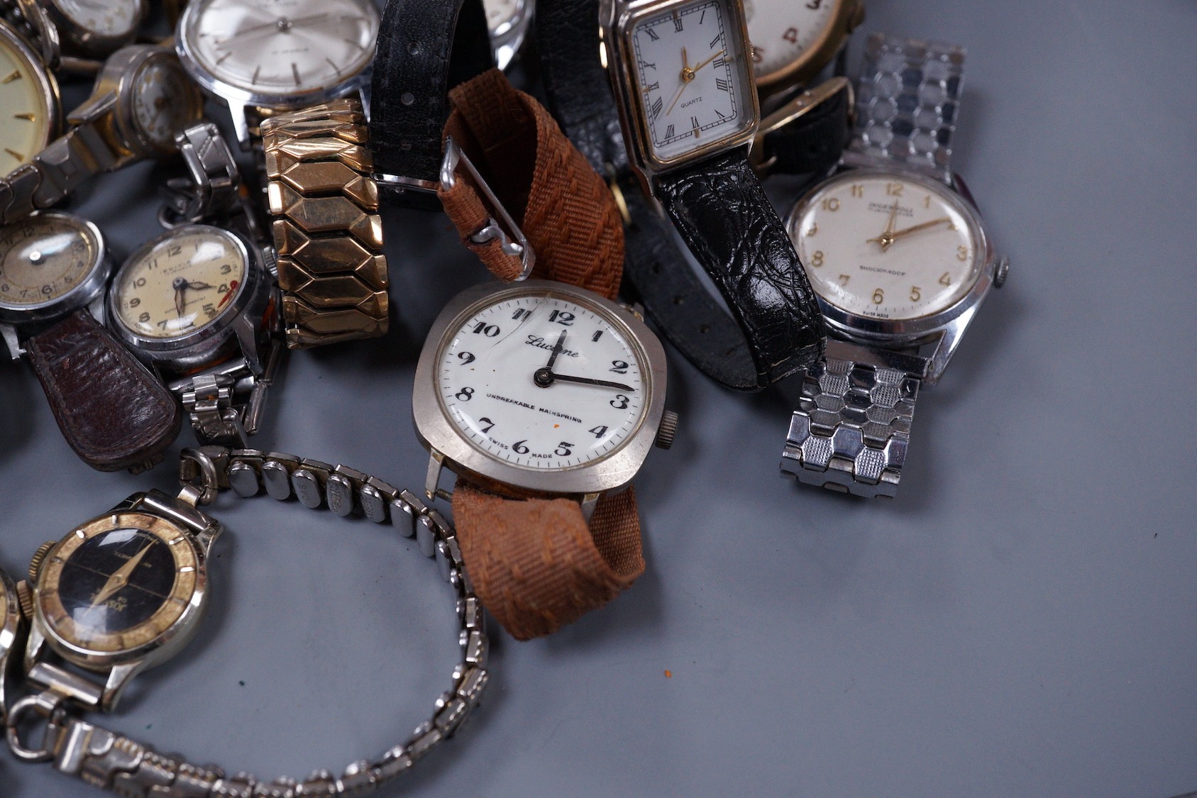 Seven assorted gentleman's wrist watches including steel Ingersoll and steel Technics, Adano and Sekonda and twelve assorted lady's wrist watches including Timex, Editia and a yellow metal Winegartens.